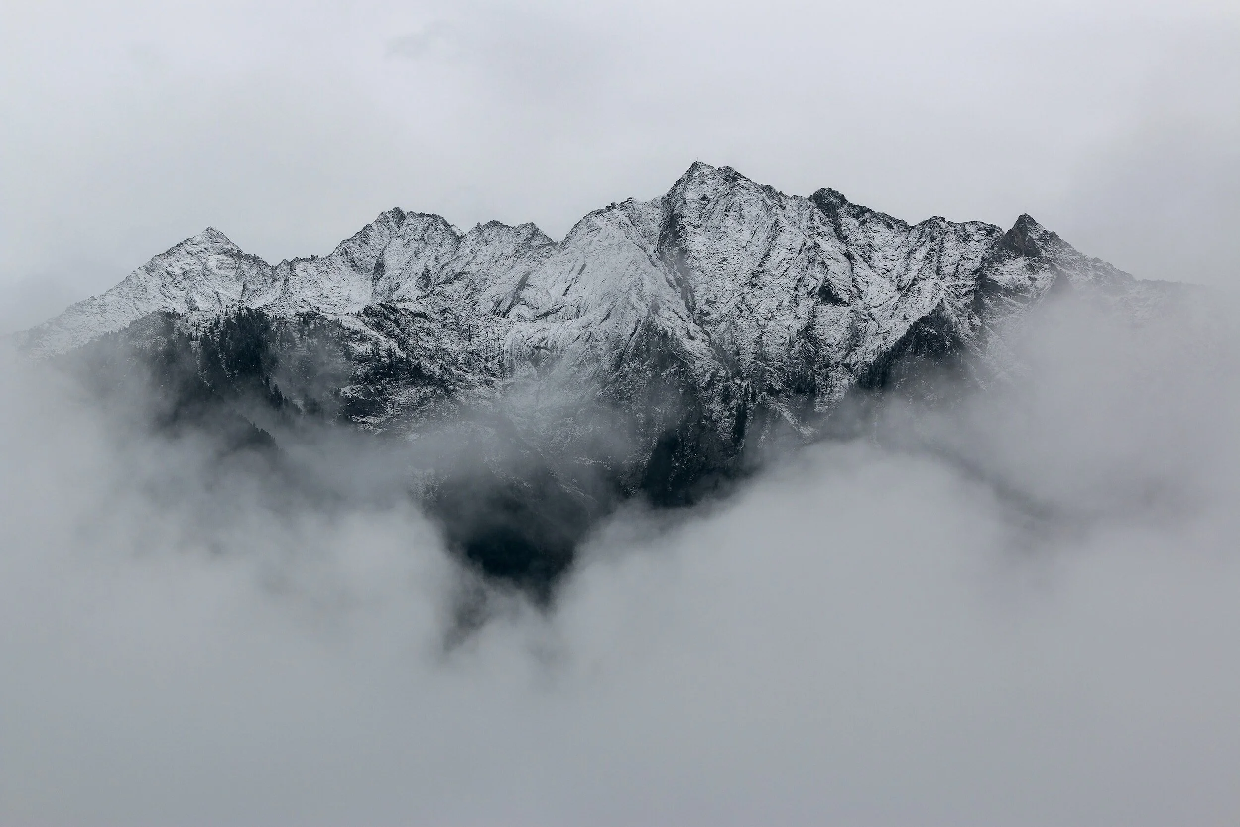 Swiss alpine mountains in fog